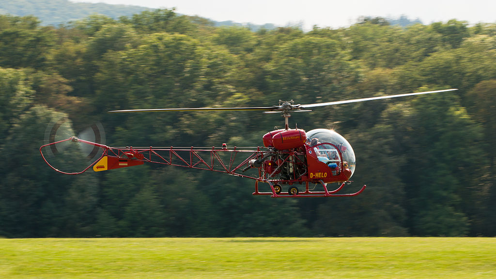 the helicopter is in mid-flight with its rotor blades turning. Photo: 