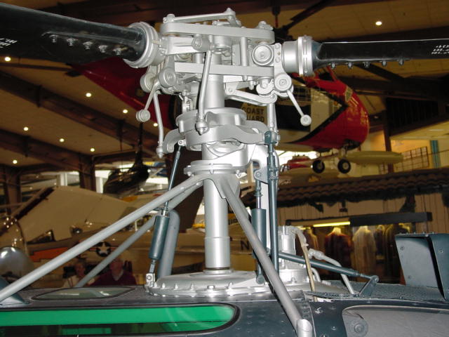 A close-up view of the rotor head of a helicopter.